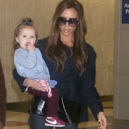 Victoria Beckham and Harper at airport