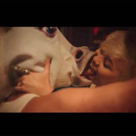 Miley Cyrus kissing unicorn