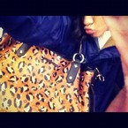 Rihanna works her leopard print arm-candy online