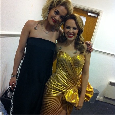 Rita Ora & Kylie do matching make-up backstage at X Factor