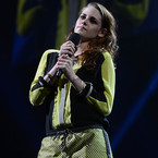 Kristen Stewart does sporty jumpsuit for Sandy Relief concert 
