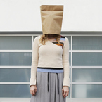 Woman with paper bag on her head