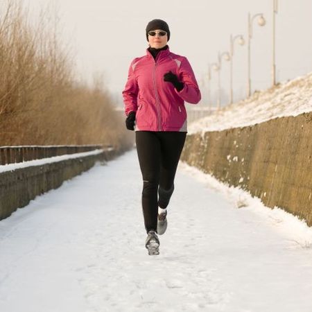 woman running in the snow