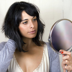 Woman looking in mirror