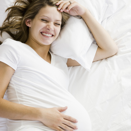 Pregnant woman in bed