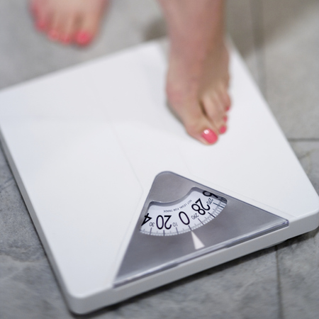 woman standing on scales
