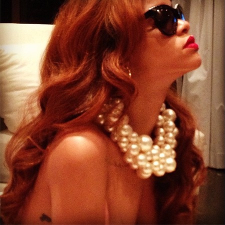 Rihanna shows off new red hair and Chanel jewellery