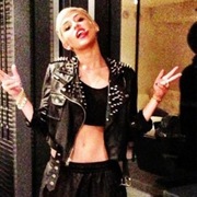 Miley Cyrus shows off studded tomboy style
