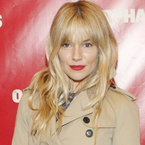 Sienna Miller rocks new fringe with red lips
