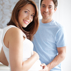 Pregnant couple holding hands