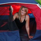 Girl smiling in a tent