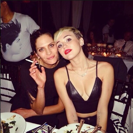 Miley Cyrus wears plunging leather crop top