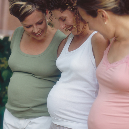pregnant women standing together
