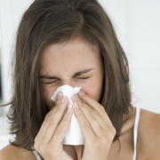 Woman sneezing