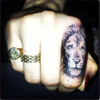 LOOK! Cara Delevingne debuts new lion tattoo
