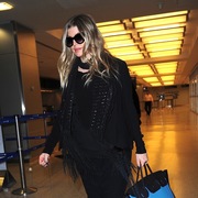 Pregnant Fergie lands at JFK
