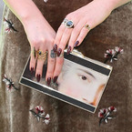 Florence Welch in Louis Vuitton with Anya Hindmarch Duchess Lady clutch bag