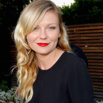 RED LIPS: Kirsten Dunst perfects the party pout