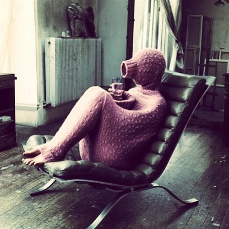 Cheryl Cole covers up in full body knitwear