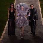 peeta, effie and katniss - hunger games cathcing fire - captial party - handbag.com
