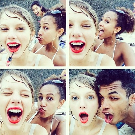 taylor swift red lipstick - apply makeup using phone as mirror - handbag.com