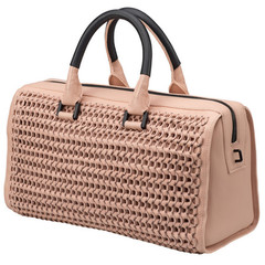 candice swanepoel victorias secret cream handbag - bottle top bag designed by narcisco rodriguez - charity ethical handbags - handbag.com