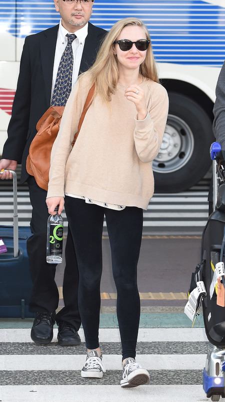 Celebrities wearing a backpack